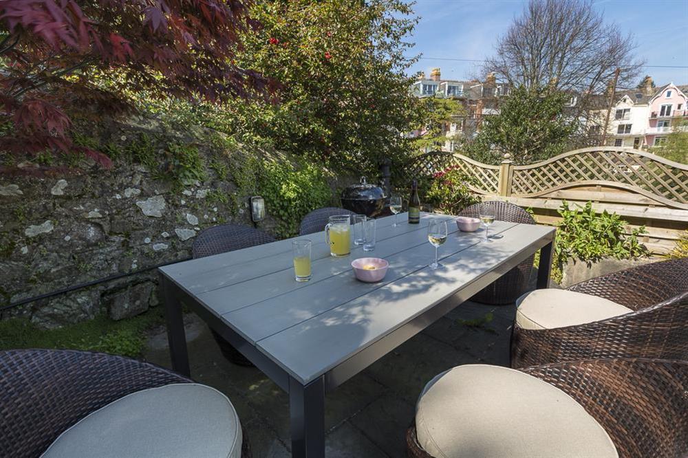 Second tier of beautiful decked terrace, with barbecue and furniture for al fresco dining at 16 Courtenay Street in , Salcombe