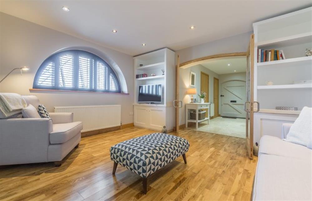 Ground floor:  Sitting room with lovely wooden floors at 16 The Granary, Wells-next-the-Sea
