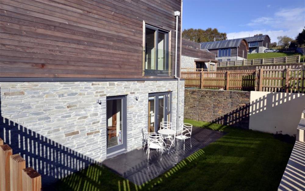 The exterior of Number 17 showing the patio at 17 Talland in Talland Bay