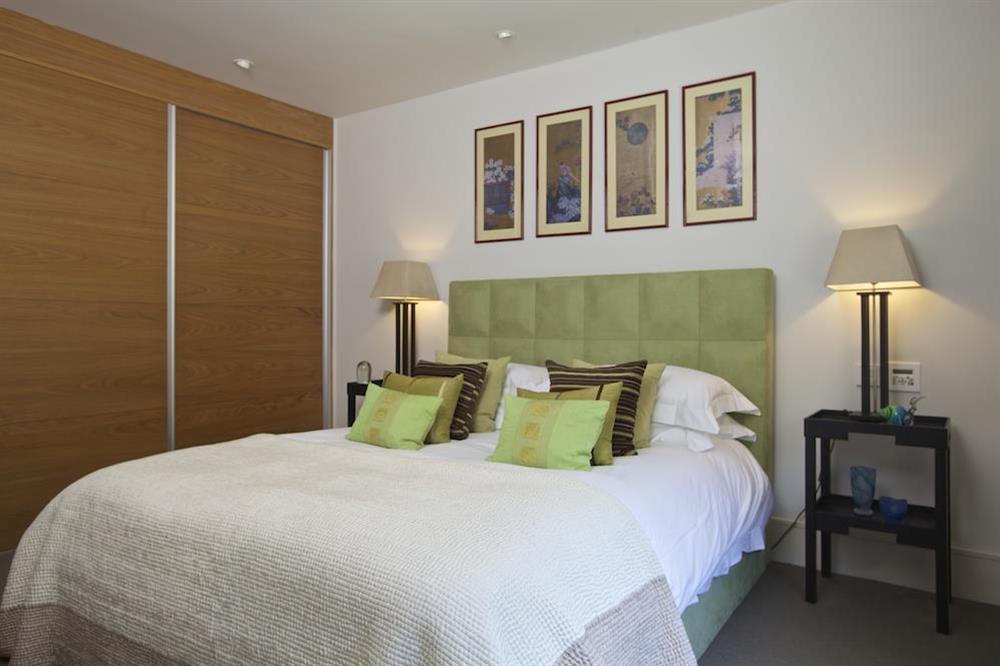 En suite master bedroom with King size bed at 18 Dart Marina in , Dart Marina