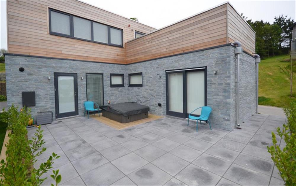 No 18's lower terrace with covered hot tub. at 18 Talland in Talland Bay