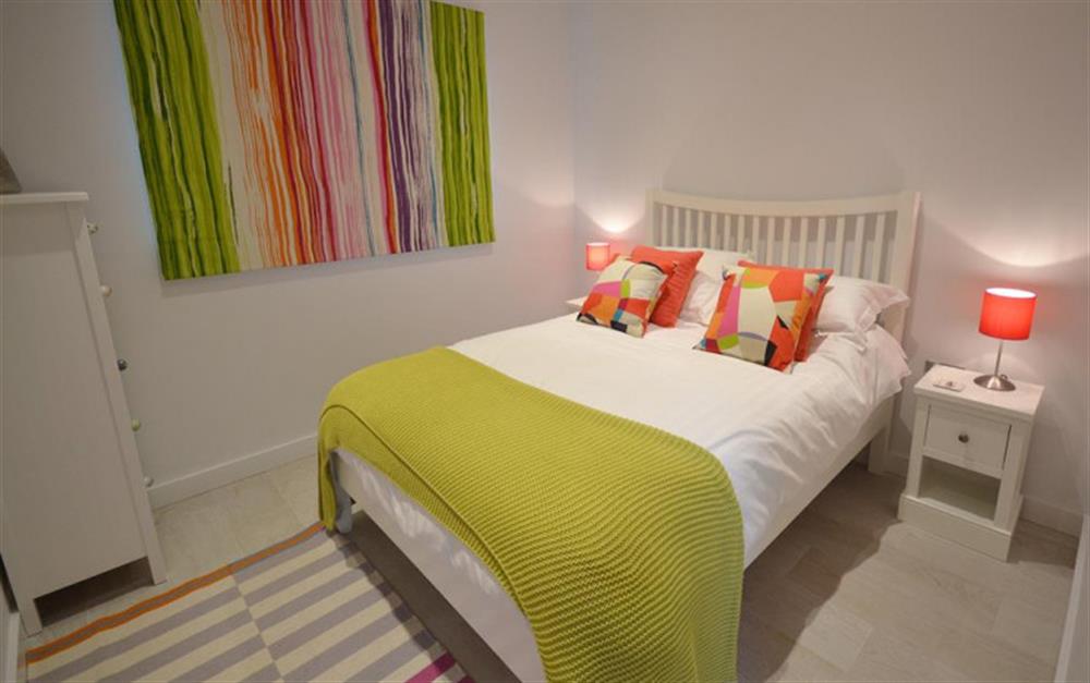 The first bright and colourful double bedroom at 18 Talland in Talland Bay