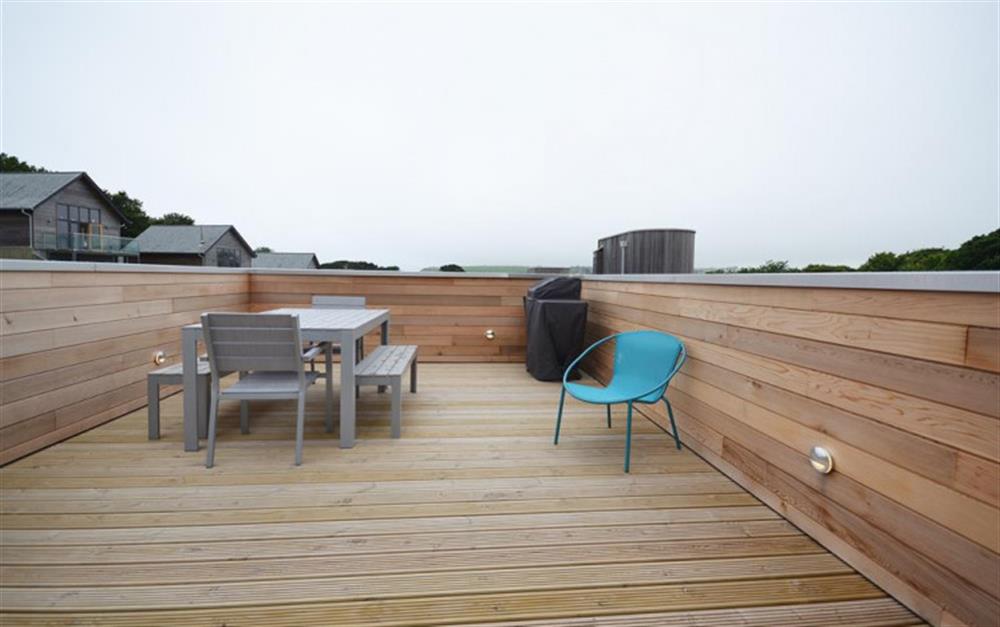 The top roof terrace with talbe and chairs at 18 Talland in Talland Bay