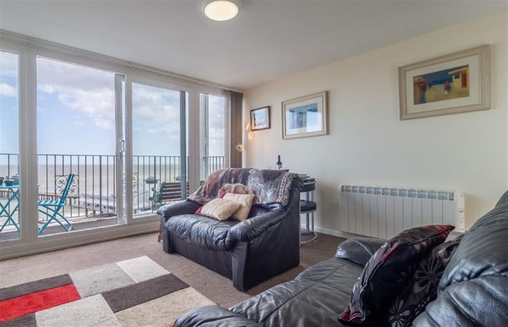 Open plan living space with balcony looking out to the sea front at 18 Undercliffe, Felixstowe