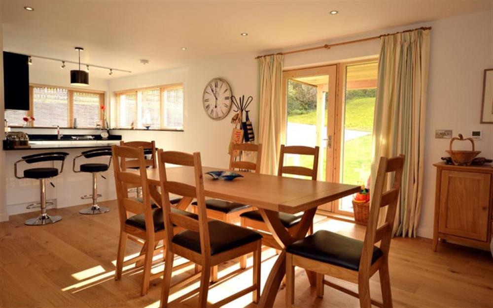 The sunny kitchen and dining area at 19 Talland in Talland Bay