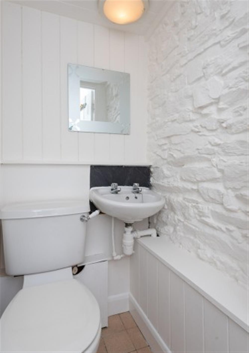 The cloakroom with basin and WC at 1b Harbour View in Salcombe