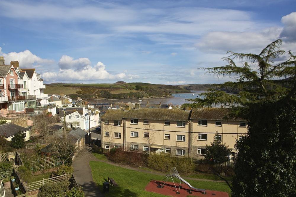 Views over rooftops to the estuary from the balcony and living area at 1c Harbour View in Devon Road, Salcombe