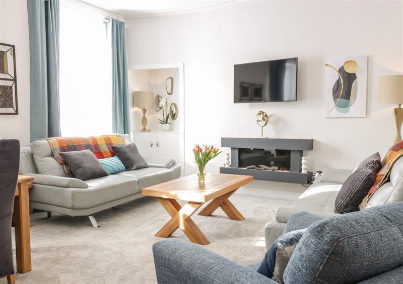 Relax in the living area at 2 Abbey Row, Kelso