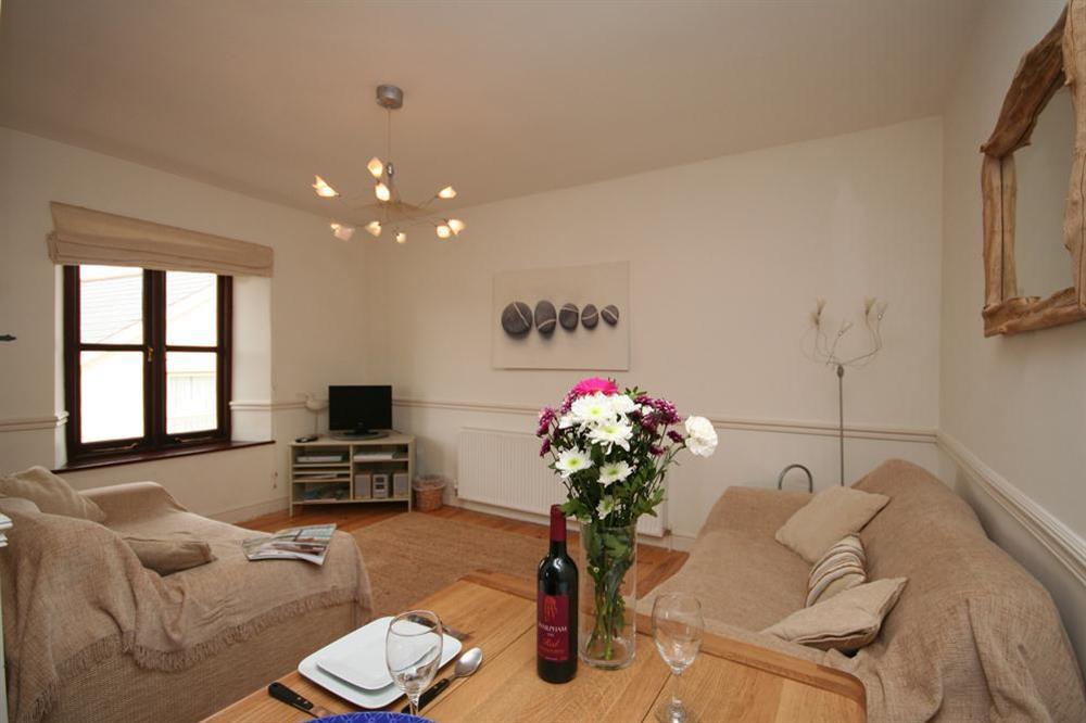 Comfortable lounge with glimpses of the beach at Hope Cove at 2 Armada Apartments in Hope Cove, Nr Kingsbridge