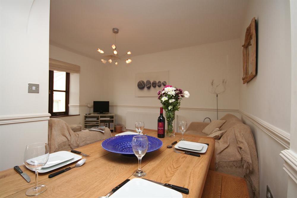 Dining area leading into the lounge at 2 Armada Apartments in Hope Cove, Nr Kingsbridge