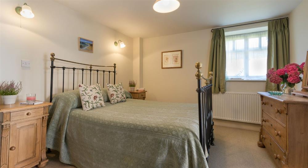 The large double bedroom at 2 Cart Lodge Barn in Upper Sheringham, Norfolk