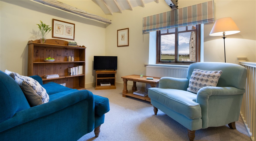 The open plan kitchen, dining and sitting room at 2 Cart Lodge Barn in Upper Sheringham, Norfolk