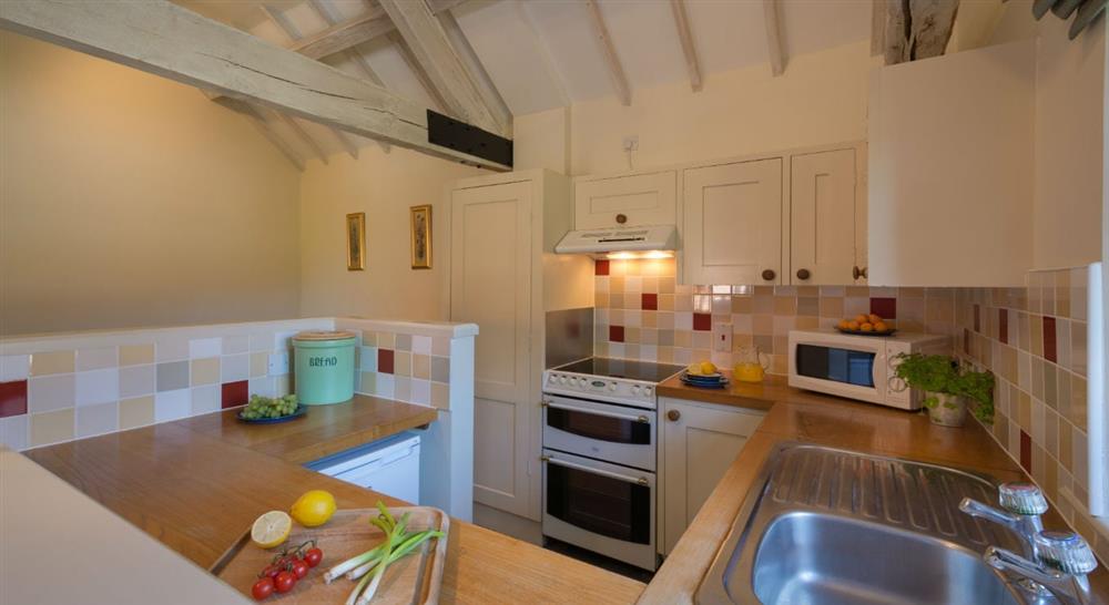 The open plan kitchen at 2 Cart Lodge Barn in Upper Sheringham, Norfolk