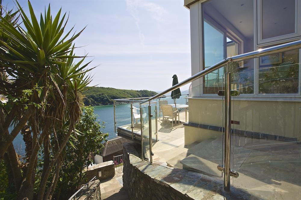 The terrace, accessed from the front of the property overlooks the estuary at 2 Channel View in Bennett Road, Salcombe
