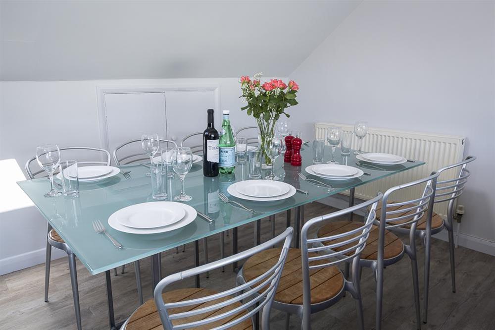 Dining area has a large table seating up to eight guests at 2 Churchill House in Market Street, Salcombe