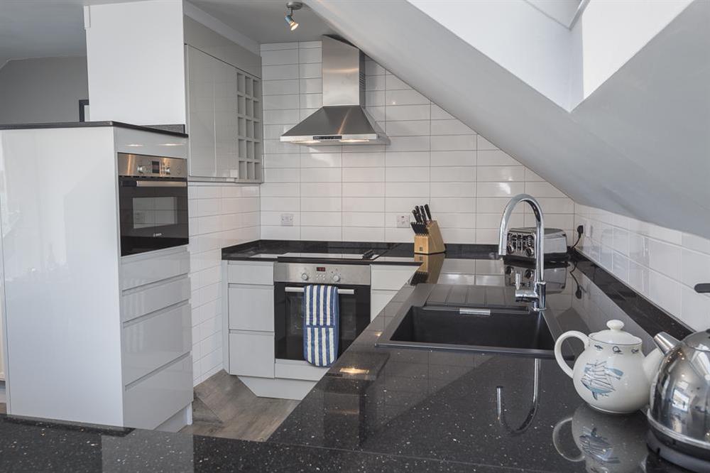 Modern kitchen with granite worktops at 2 Churchill House in Market Street, Salcombe