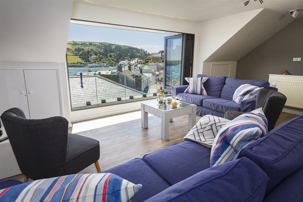 Very comfortable lounge area with bi-folding doors at 2 Churchill House in Market Street, Salcombe
