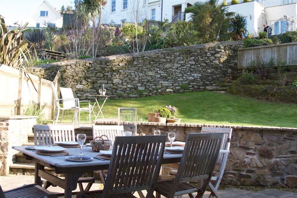 The garden area just off the kitchen with table and chairs at 2 Combehaven in Allenhayes Road, Salcombe