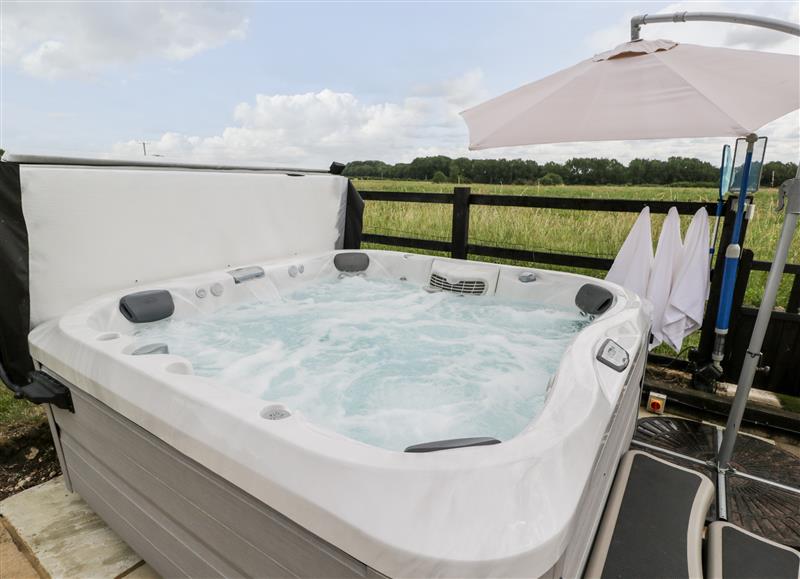 Spend some time in the hot tub at 2 Dewars Farm Cottages, Middleton Stoney