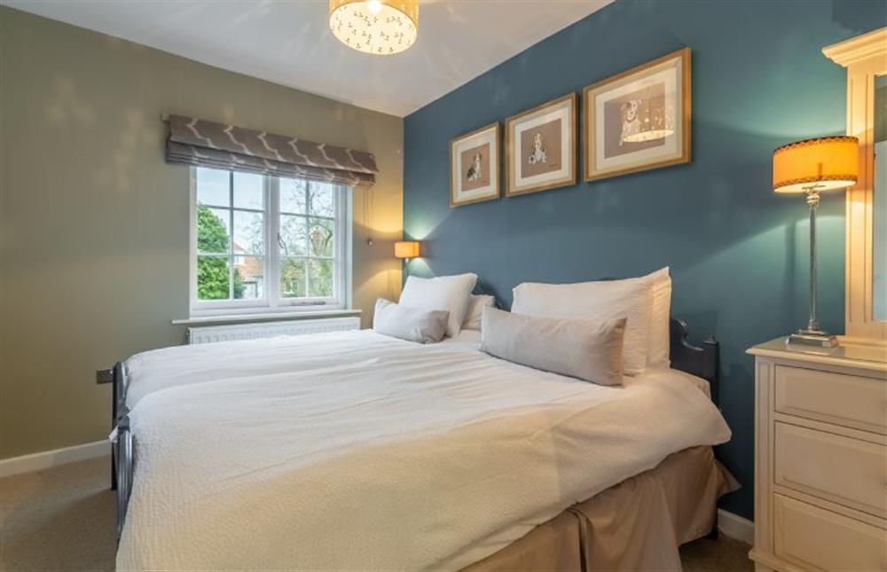 First floor: Bedroom three with twin beds at 2 Dix Cottages, Thornham near Hunstanton