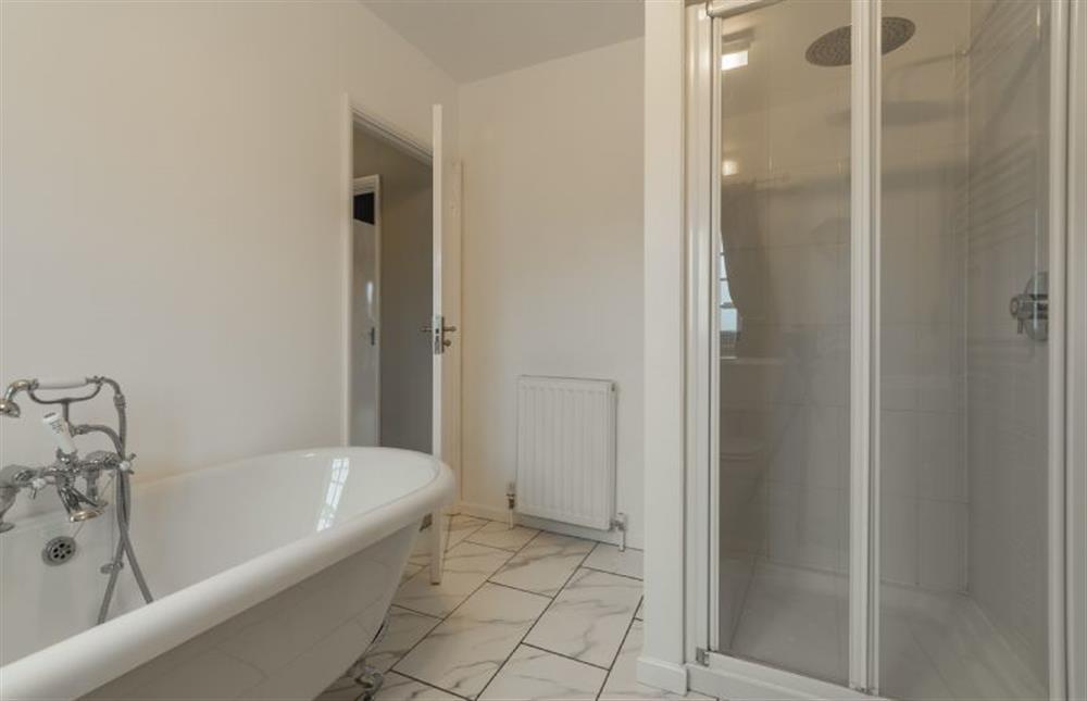 First Floor: Family bathroom with shower and bath at 2 Dix Cottages, Thornham near Hunstanton