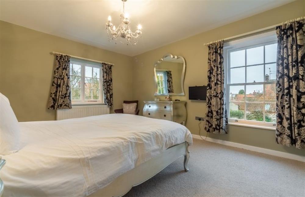 First floor: Master bedroom with double aspect at 2 Dix Cottages, Thornham near Hunstanton