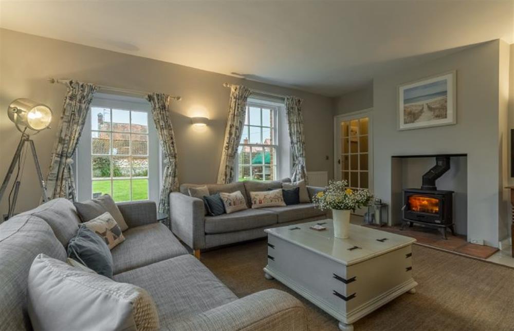 Ground floor: Sitting room with wood burning stove at 2 Dix Cottages, Thornham near Hunstanton