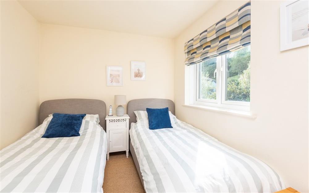 Bedroom 3 at the rear of the cottage with twin beds at 2 Florence Cottage in Torcross