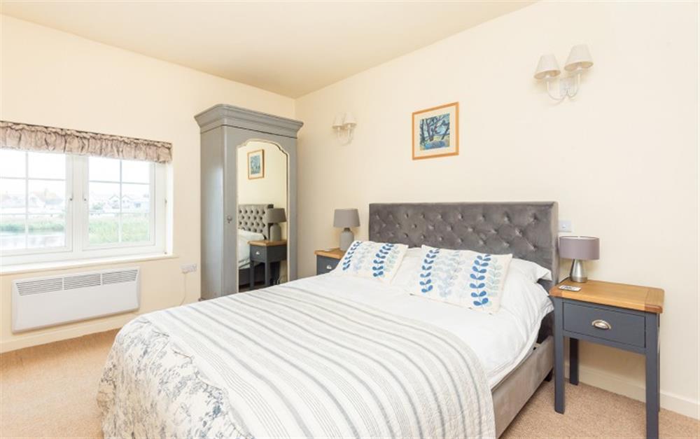 The master bedroom with views over the ley at 2 Florence Cottage in Torcross