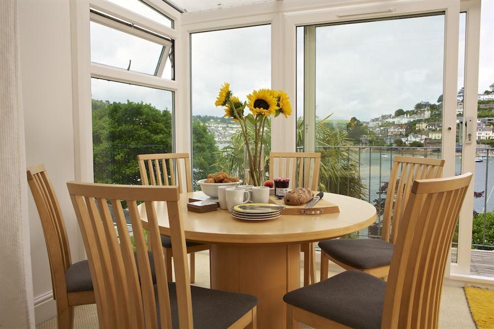 Dining table with access to the decked area at 2 Galions Quay in , Dartmouth