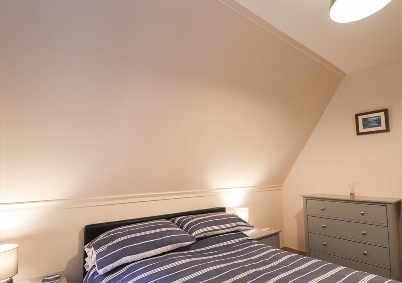 A bedroom in 2 Glen Garry Lodge at 2 Glen Garry Lodge, Lagan near Invergarry