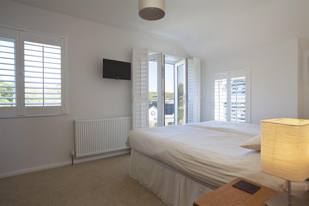 Twin room with French doors and (distant!) view of Batson Creek at 2 Gould Road in , Salcombe