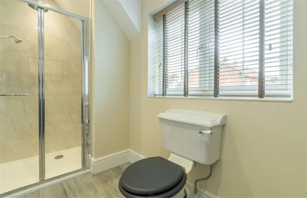 First floor: En-suite to master bedroom with shower cubicle, WC and hand basin at 2 Hall Lane Cottages, Thornham near Hunstanton