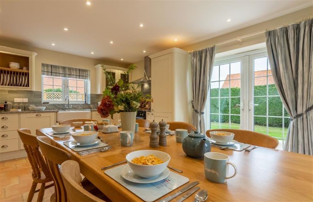 Ground floor: Dining area with french doors to the garden at 2 Hall Lane Cottages, Thornham near Hunstanton