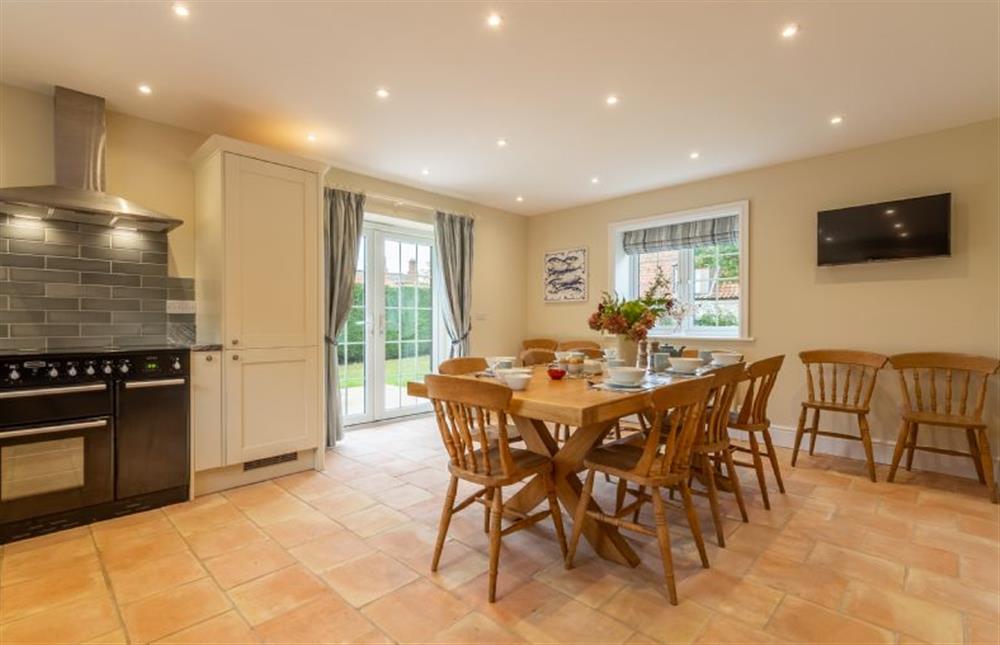 Ground floor: Well-equipped kitchen with double Belfast sink, electric range, combi microwave/ oven/ grill, fridge/freezer, dishwasher dining table (with seating for up to 12 guests) and french doors to the garden