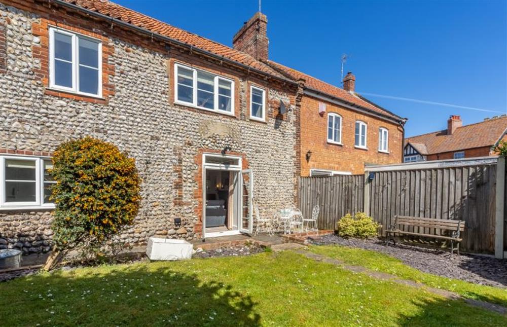 A sunny rear garden with a choice of seating at 2 Hammond Square, Weybourne near Holt