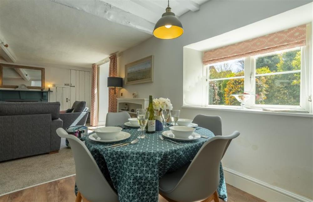 Ground floor: Dining table with seating for four guests at 2 Hammond Square, Weybourne near Holt