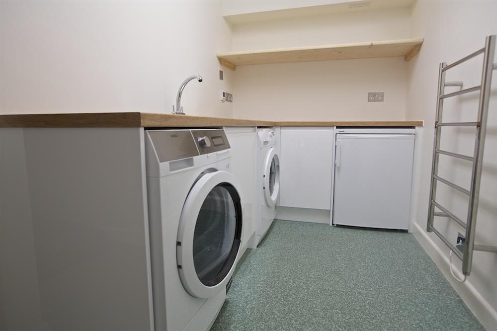 Utility room with washing machine and tumble drier at 2 Hamstone Court in , Salcombe