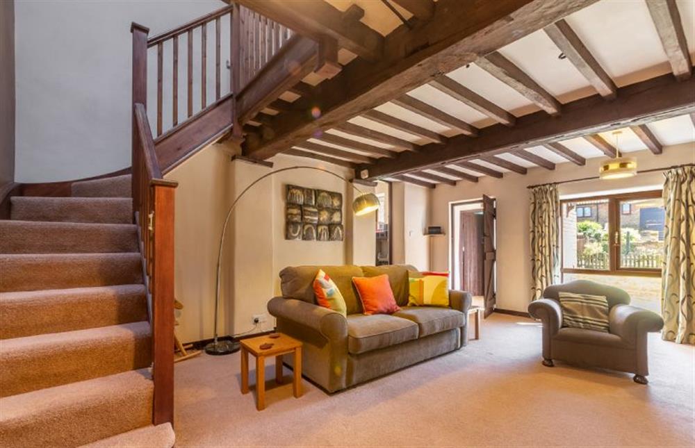 Ground floor: Sitting area with stairs leading to the first floor at 2 Manor Court, Syderstone near Kings Lynn