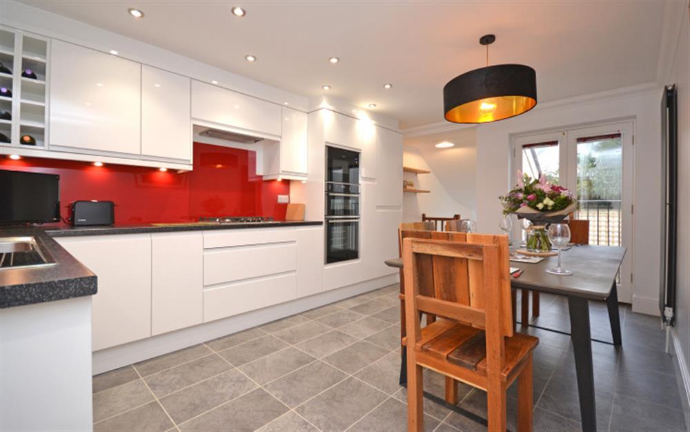 The contemporary kitchen dining room. at 2 North Castle Mews in Totnes