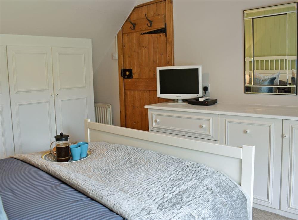 Beautifully decorated double bedroom with kingsize bed (photo 2) at 2 Northbank Cottages in Whiting Bay, Isle of Arran, Scotland