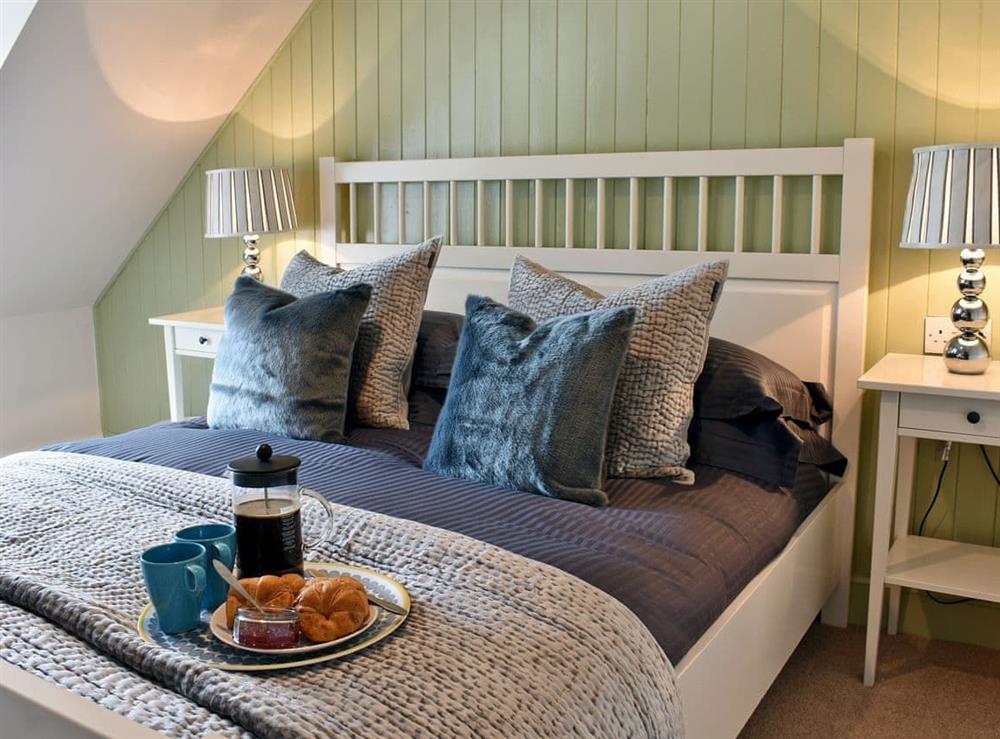 Beautifully decorated double bedroom with kingsize bed at 2 Northbank Cottages in Whiting Bay, Isle of Arran, Scotland