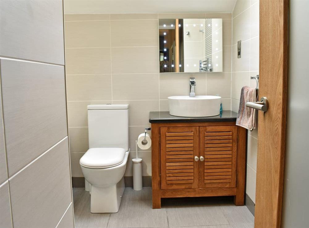 Modern style bathroom at 2 Northbank Cottages in Whiting Bay, Isle of Arran, Scotland