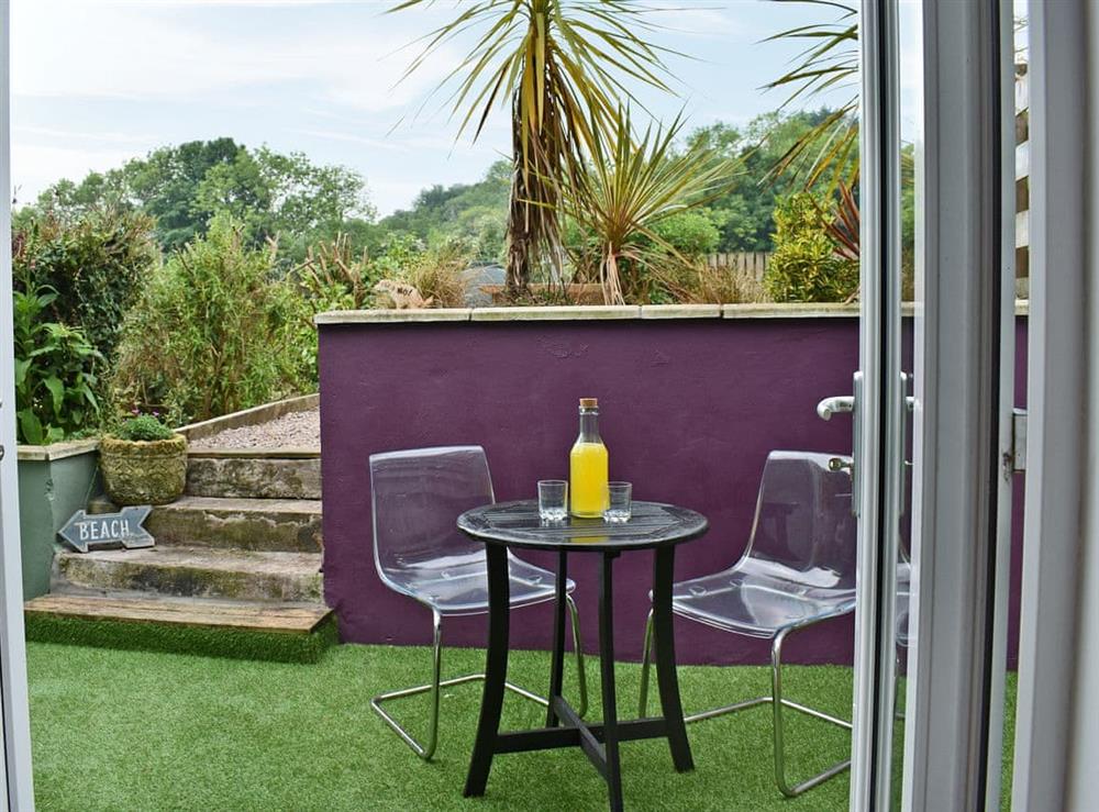 Relaxing patio area at 2 Northbank Cottages in Whiting Bay, Isle of Arran, Scotland