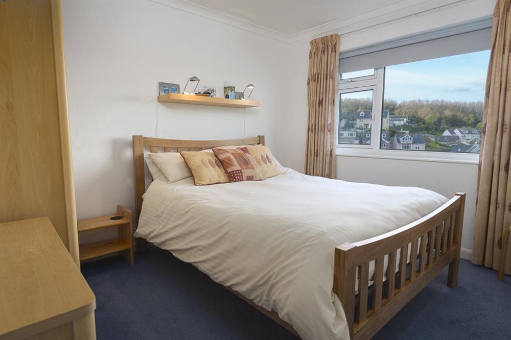 Master bedroom with King-size bed at 2 Rockmount in Knowle Road, Salcombe