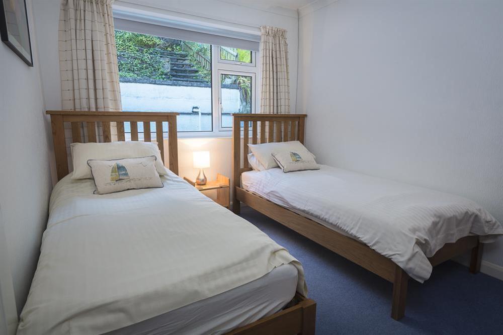 Twin bedroom with two single beds at 2 Rockmount in Knowle Road, Salcombe