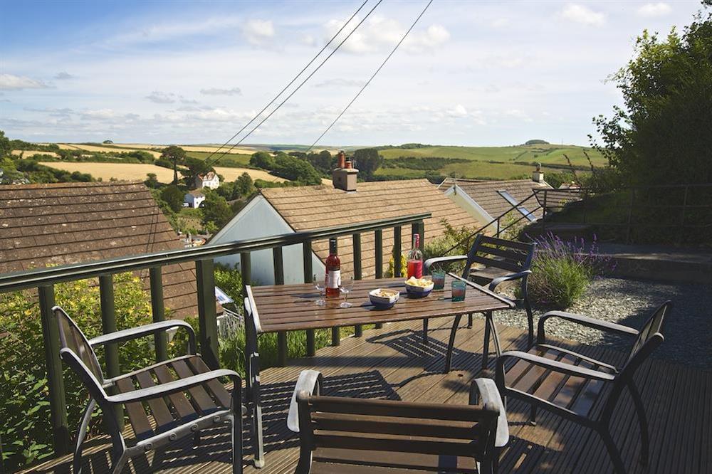 Upper terrace with table and chairs provides views towards Snapes Point at 2 Rockmount in Knowle Road, Salcombe