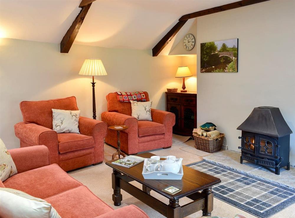 Comfortable living area with a gorgeous wood burner (photo 2) at 2 Swallowholm Cottages in Arkengarthdale, near Reeth, North Yorkshire