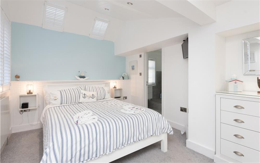 The Master bedroom with en-suite at 2 The Beach in Lyme Regis