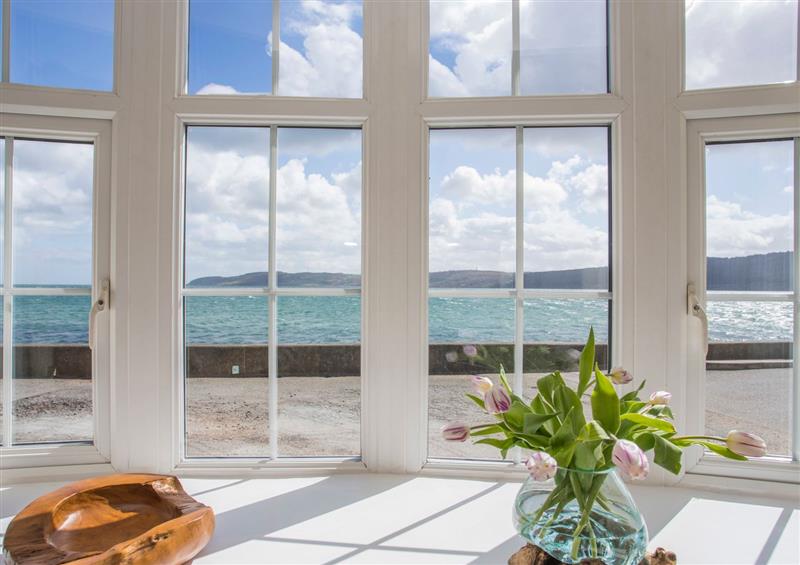 Relax in the living area at 2 The Coach House, Red Wharf Bay near Benllech